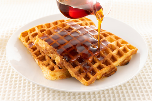 Sprinkle plenty of maple syrup on the waffles