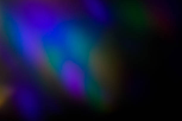 istock colorful warm rainbow light leaks on black background with dust texture 1306421027