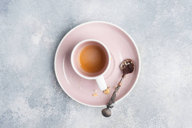 istock Empty dirty dishes after eating, cup after coffee and a plate with a teaspoon. 1306421106