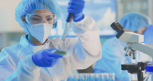 istock asian scientist take test tube 1306425816
