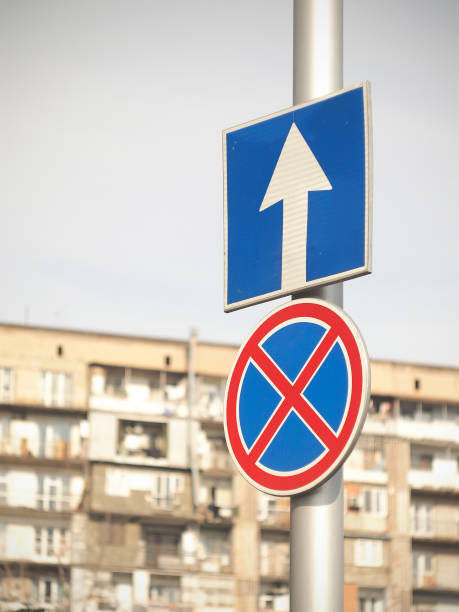 istock Road signs with a multistory building background 1306428459