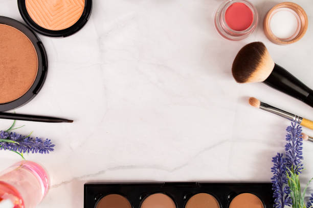 istock Makeup products, cosmetics, brushes, shadows on a white background top view with place for text, copy space. Set of different makeup products 1306429606