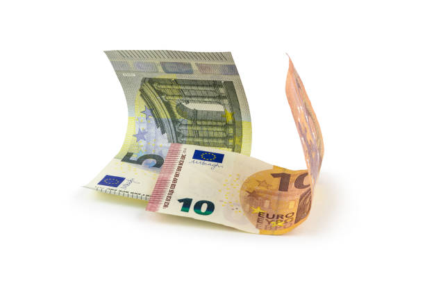 istock Two curved 5 and 10 euro banknotes isolated on white with light shadow 1306431341