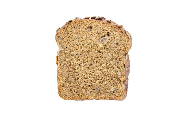 istock Dark bread, with sunflower seeds, cut off piece isolated on white background with clipping path. 1306433377
