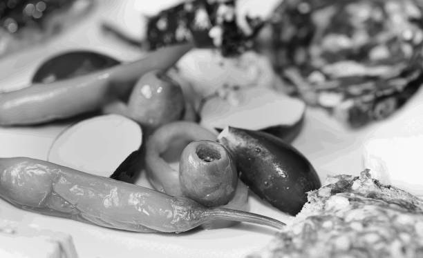 istock fresh vegetable side dish in a vesperteller with blurred salami bread in black and white 1306434918