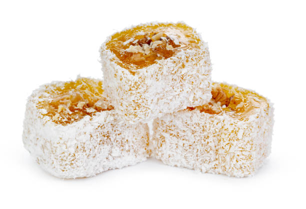 istock Yellow Turkish Delight with nuts in powdered sugar isolated on white 1306435950
