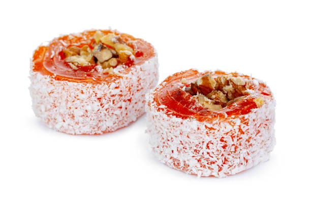 istock Orange Turkish delight with nuts in powdered sugar isolated on white 1306435972