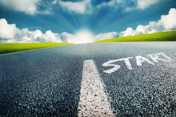 istock Empty Street With Starting Line And Sunrise At The Horizon 1306437734
