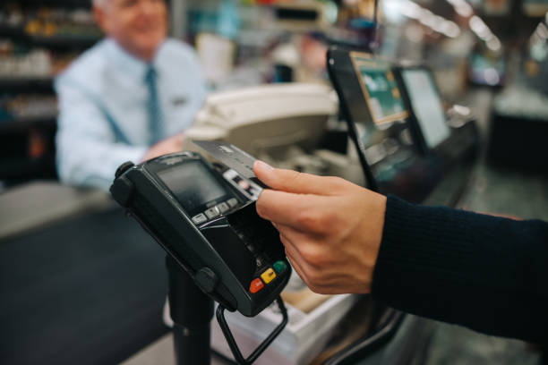 istock Customer making contactless payment at supermarket 1306439206