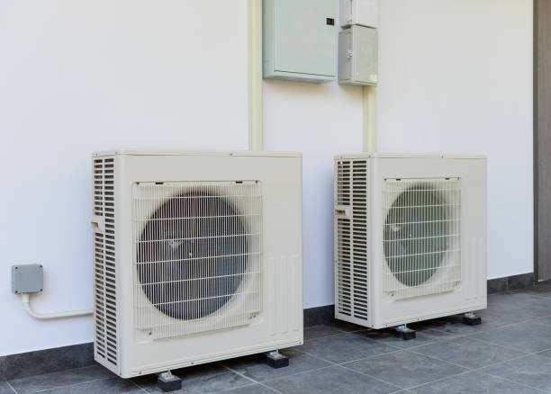 istock Air conditioning compressor outdoor unit installation of the building side wall 1306440044