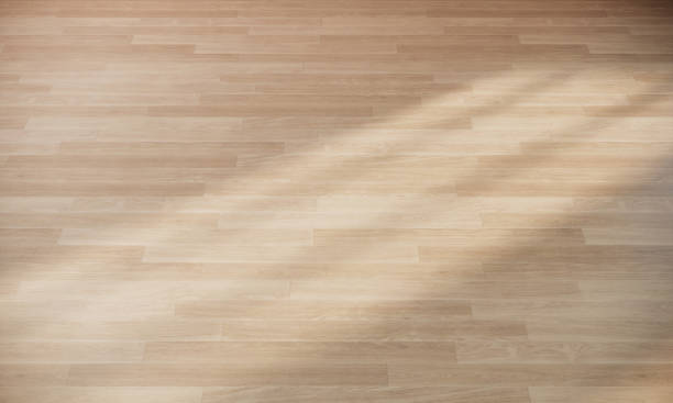 istock wooden floor background, light on parquet floor, 3d rendering 1306441469