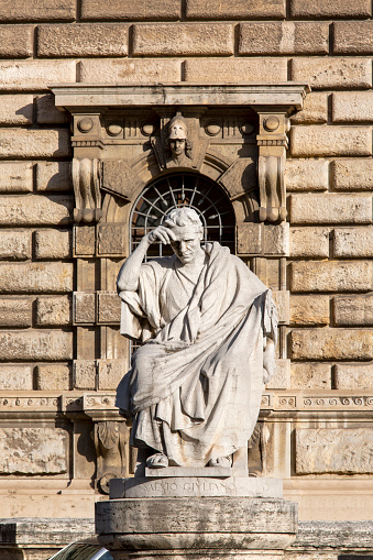 Rome, Italy - October 9, 2020: Statue of Salvius Julianus (Salvio Giuliano) at the front of Palace of Justice seat of Supreme Court of Cassation (Corte di Cassazione), majestic building on the Tiber River