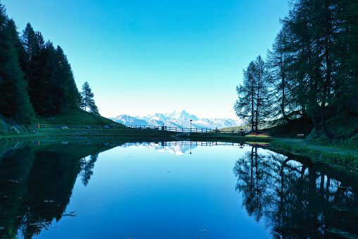 Beautiful reflection of the Mont Blanc on the Lake Blue in La Plagne Village in Savoie