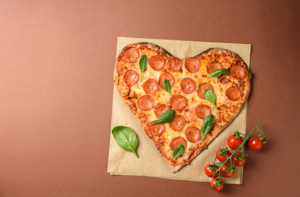 istock Heart shaped pizza pepperoni 1306443691