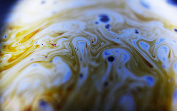 istock The surface of the bubble. Close-up. Black background. Bright colors. Side view. A high resolution. Imitation of an unknown planet 1306443714
