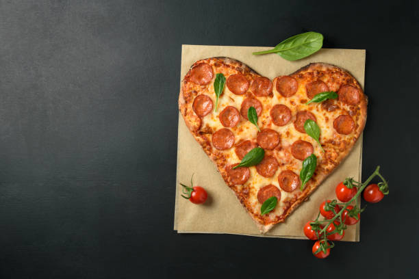 istock Heart shaped pizza pepperoni 1306443726