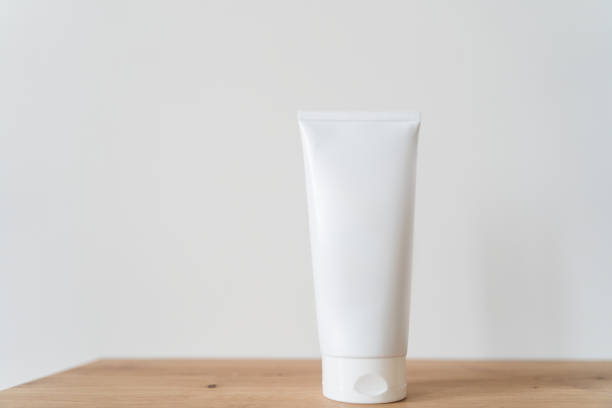 istock White tube cream mockup on a wooden table 1306444246