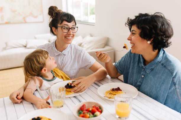 istock Female couple with son having breakfast 1306444272