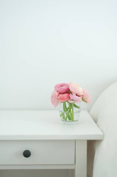 istock Peonies in glass interior home 1306444328
