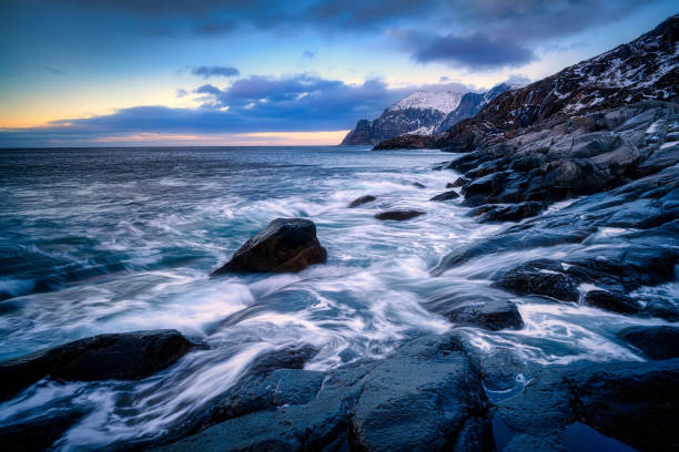 Beautiful winter landscape scene in Mefjord and mountain in background in Northern Norway. sunset or sunrise in Mountains And Fjords.