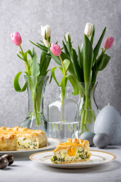 istock Torta Pasqualina. Traditional Italian savory Easter pie with spinach, chard, ricotta and whole eggs on gray background. 1306448295