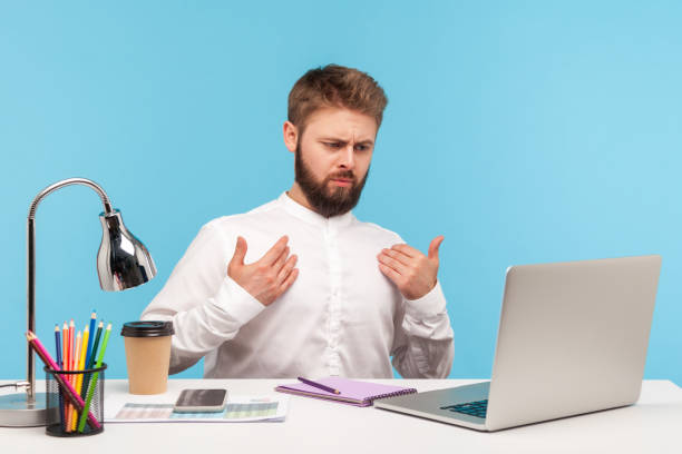 istock This is me! Selfish businessman sitting office workplace, pointing himself looking self-confident at laptop screen, talking on video call and boasting 1306450307