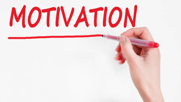 istock human hand writing inscription MOTIVATION on whiteboard 1306450369
