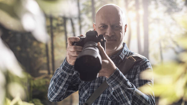 istock Professional photographer shooting in the wilderness 1306450429