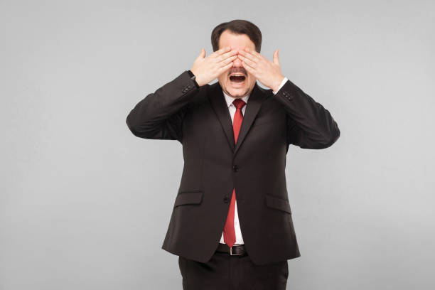 istock Man closed eyes and don't see any more 1306450506