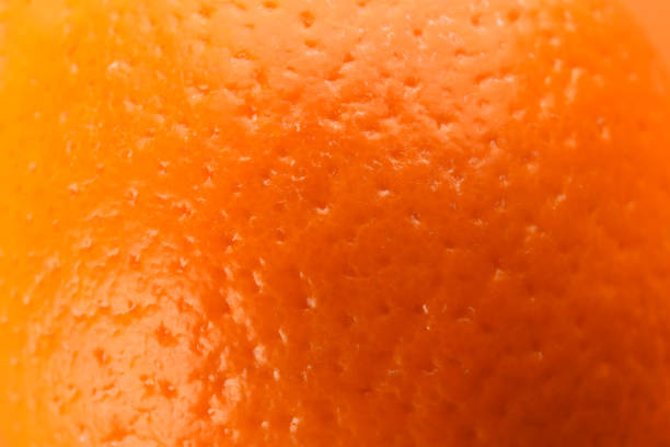 istock Delicious unpeeled orange fruit as background, closeup 1306450613