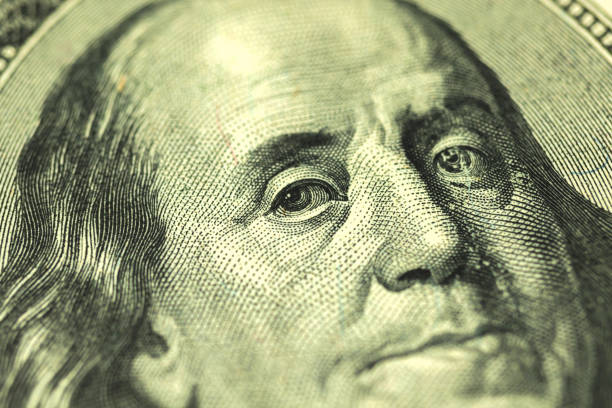 istock Benjamin Franklin's face on the US hundred dollar bill, macro photo 1306450830