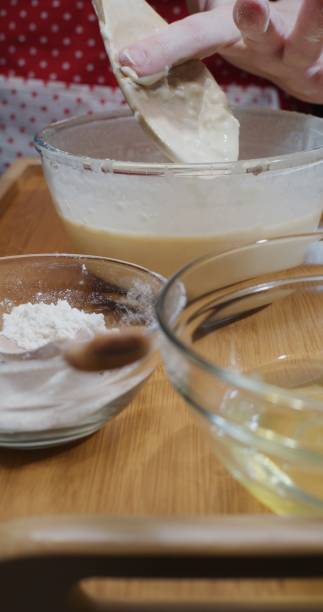 istock Making French crepe batter at home. Close-up vertical front view 1306453480