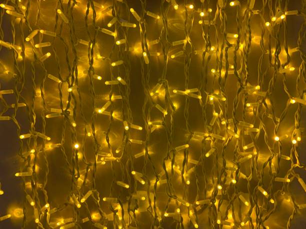 istock Gold christmas lights background 1306453580