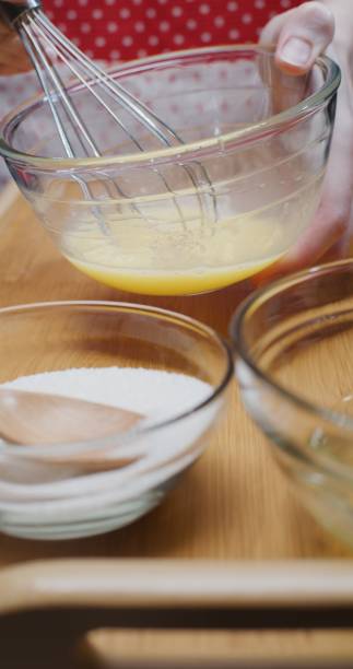 istock Making French crepe batter at home. Close-up vertical front view 1306453658