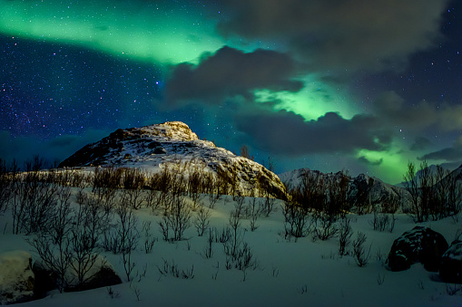 Beautiful winter night landscape scene mountain in Northern Norway. Sunset or sunrise in Mountains And Fjords. Knuten