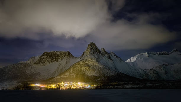 istock Mefjord village at night under majestic mountain 1306456442