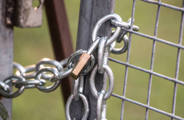 istock locking doors and porperty with a key, security against burglary 1306458406