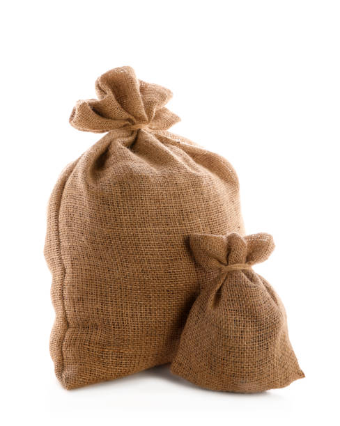 istock Tied burlap bags on white background. Organic material 1306461485