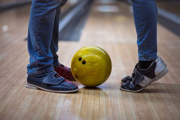 istock Couple at a bowling alley. 1306463551