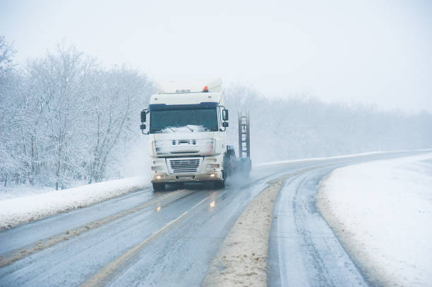 istock Truck on the winter highway 1306466785