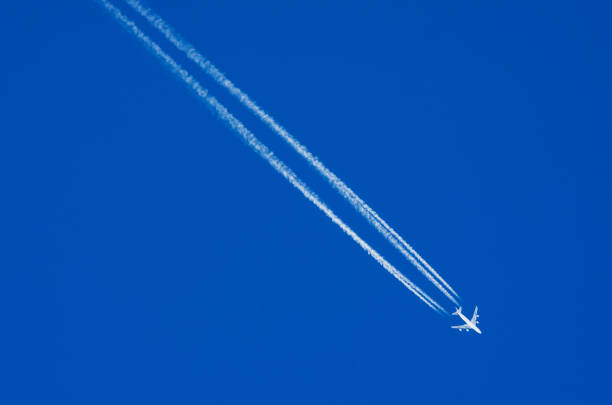istock Airplane descending is removed leaving a white contrails 1306468966