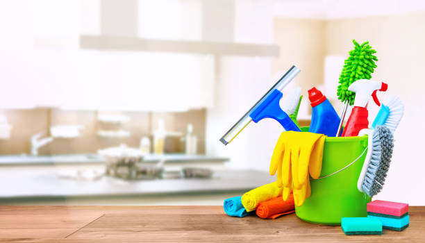 istock Cleaning items in a bucket on a wooden table 1306469464