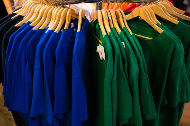istock T-shirts on hangers in the store 1306470690