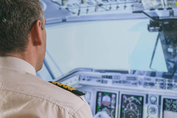istock Airline pilot wearing uniform with epauletes 1306470792