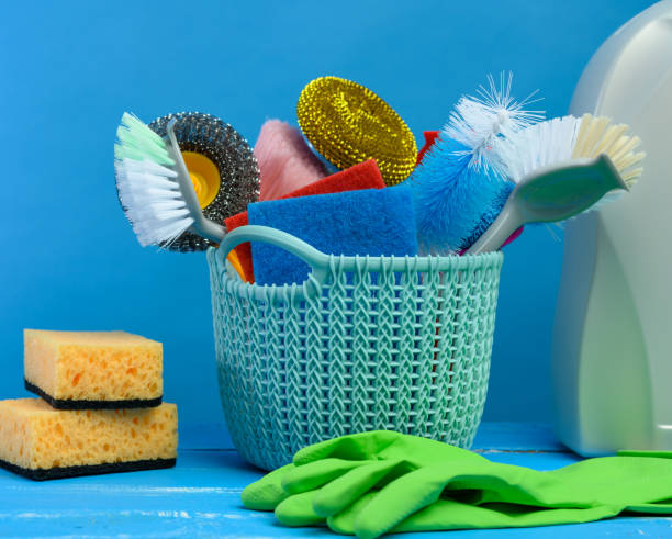 istock blue plastic basket with brushes, sponges and rubber gloves for cleaning 1306470995