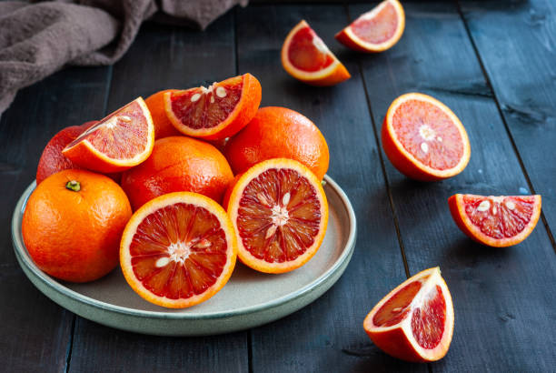 istock Sicilian blood oranges on dark background 1306471911
