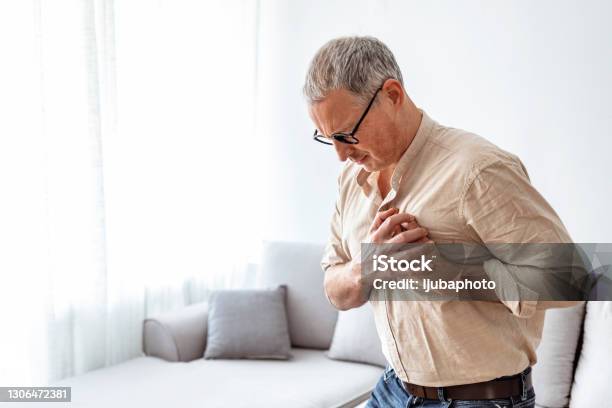 Chest Pains Are Never A Good Sign Stock Photo - Download Image Now - Heartburn, Heart Attack, Heart - Internal Organ