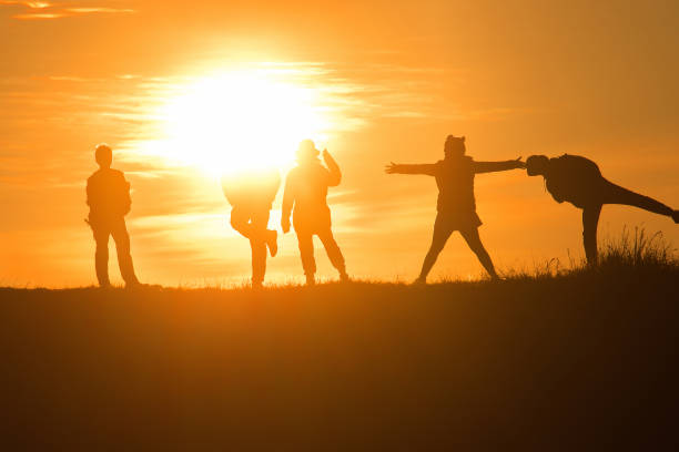 istock Travelers silhouettes against the orange light 1306473106