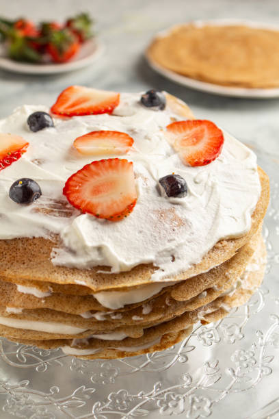 istock Making cooking pancake cake on a grau background close-up. Home cooking 1306473388
