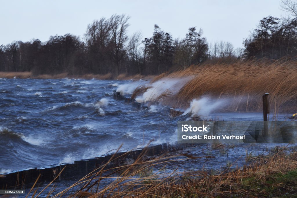 spring storm causes splashing water and high waves at the Reeuwijkse Plassen, Reeuwijk, The Netherlands Bay of Water Stock Photo